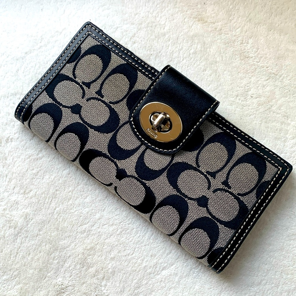 Coach signature double sided wallet with silver turn lock.